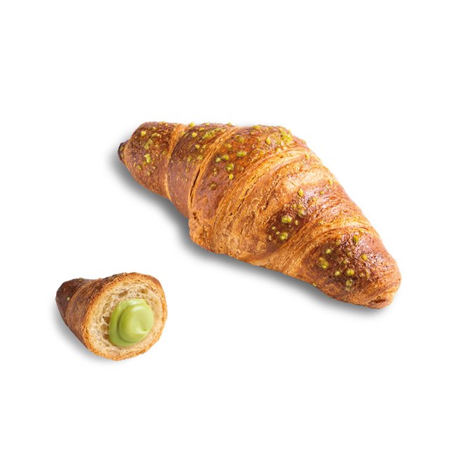 Aranyszínű croissant pisztáciamorzsával, egy kisebb szelet felvágva mutatja a zöld pisztáciakrémet.
