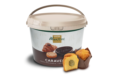 Nagy vödör Master Martini Caravel kenhető krém egy felvágott, töltött muffin és egy egész muffin mellett.